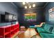 Cozy living room featuring dark walls, modern lighting, and a view to a garden at 130 N Bloodworth St, Raleigh, NC 27601