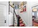 Stylish staircase with colorful runner and art-lined walls leading upstairs at 130 N Bloodworth St, Raleigh, NC 27601