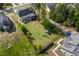 Aerial view of a large backyard with playground, garden, and trees adding charm and plenty of room for outdoor enjoyment at 1427 Bungalow Ave, Durham, NC 27703