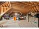 Spacious unfinished attic storage space with exposed wooden beams and ample room for organization at 1427 Bungalow Ave, Durham, NC 27703