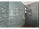 Walk-in shower with sleek subway tiling, niche shelving, and modern fixtures for a luxurious experience at 1427 Bungalow Ave, Durham, NC 27703