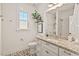 Modern bathroom with granite countertops, stylish vanity, and decorative mosaic tile flooring at 1427 Bungalow Ave, Durham, NC 27703