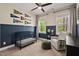 Comfortable bedroom featuring a crib, chair, and sports decor for a playful atmosphere at 1427 Bungalow Ave, Durham, NC 27703