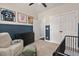 Well-lit bedroom with neutral tones features athletic decor, comfortable seating and ample storage at 1427 Bungalow Ave, Durham, NC 27703