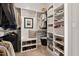 Spacious closet offers extensive storage, shelving, and a seating area for ultimate organization at 1427 Bungalow Ave, Durham, NC 27703
