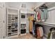 Well-organized walk-in closet features racks, shelves, drawers and custom shoe and accessory storage at 1427 Bungalow Ave, Durham, NC 27703