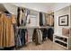 Organized walk-in closet with ample shelving, racks, and storage for shoes and accessories at 1427 Bungalow Ave, Durham, NC 27703