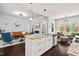 Open concept kitchen with a large island, seamlessly connected to the inviting living room area at 1427 Bungalow Ave, Durham, NC 27703