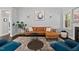 Inviting living room featuring a comfortable sofa, stylish decor, and neutral color scheme at 1427 Bungalow Ave, Durham, NC 27703