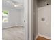 Open doorway into a bedroom featuring light wood floors, and a view of a yard outside the window at 1513 Fairfax Rd, Durham, NC 27701