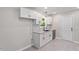 Modern kitchen features clean white cabinetry, granite countertops, and stainless steel appliances at 1513 Fairfax Rd, Durham, NC 27701