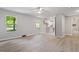Spacious living space featuring wood-look floors, and open access to a kitchen and bath at 1513 Fairfax Rd, Durham, NC 27701