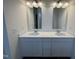 Bathroom with double vanity, quartz countertops, white cabinets and chrome fixtures at 152 Bruce Dr, Dunn, NC 28334