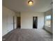 Spacious bedroom with neutral carpet, light walls, closet, and natural light at 152 Bruce Dr, Dunn, NC 28334