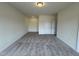 Large bedroom with neutral carpet, light walls, closet, and recessed lighting at 152 Bruce Dr, Dunn, NC 28334
