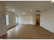 Bright living room with wood-look floors, recessed lighting, and white walls at 152 Bruce Dr, Dunn, NC 28334
