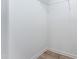 A walk-in closet features a wire shelf and light wood-look vinyl floors at 152 Bruce Drive Dr, Dunn, NC 28334