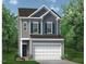 Two-story home with gray siding, attached two-car garage, and manicured lawn surrounded by mature trees at 152 Bruce Drive Dr, Dunn, NC 28334
