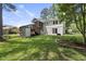 Exterior view of a two-story home featuring a deck, backyard and well-maintained landscaping at 1532 Cone Ave, Apex, NC 27502