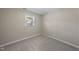 Cozy bedroom with neutral walls and carpet and a bright window with natural light at 1532 Cone Ave, Apex, NC 27502