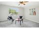 This is a versatile bonus room featuring decor, natural light, and cozy seating at 1557 Tice Hurst Ln, Apex, NC 27502