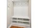 Mudroom features storage bench with cubbies and coat hooks for a clutter-free, organized entryway at 1557 Tice Hurst Ln, Apex, NC 27502