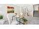 Bright office with neutral decor, complemented by an open book and views of the stairway at 1557 Tice Hurst Ln, Apex, NC 27502