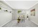Well lit office with gray walls and carpet, decorated with plants and an open window view to the yard at 1557 Tice Hurst Ln, Apex, NC 27502