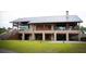 Spacious property with wooden beam accents, stone facade, metal roof and well manicured lawn at 1565 Wendell Valley Blvd, Wendell, NC 27591