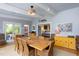 Spacious dining room with wood table, seating for eight, and stylish decor perfect for entertaining guests at 1603 Hermitage Ct, Durham, NC 27707