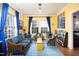 Bright and inviting living room featuring hardwood floors, and large windows that flood the space with natural light at 1603 Hermitage Ct, Durham, NC 27707