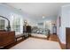 Comfortable main bedroom with a floral bedspread, hardwood floors, and lots of natural light at 1603 Hermitage Ct, Durham, NC 27707