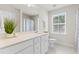 Well-lit bathroom with a long vanity, a large mirror, and modern fixtures at 176 Belleforte Park Cir, Garner, NC 27529