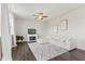 Cozy living room featuring a fireplace, plush sectional sofa, and neutral decor at 176 Belleforte Park Cir, Garner, NC 27529