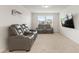 Home theater room with comfortable seating, providing a perfect space for watching movies at 176 Belleforte Park Cir, Garner, NC 27529