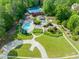 A lovely aerial view of community amenities with a pool, tennis court, and walking path at 19002 Stone Brk, Chapel Hill, NC 27517