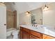 Bathroom with wooden vanity, neutral paint, and shower-tub combo at 19002 Stone Brk, Chapel Hill, NC 27517