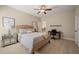 Comfortable bedroom with neutral colors, carpet floors, and a ceiling fan with attached lighting at 19002 Stone Brk, Chapel Hill, NC 27517
