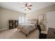 Bedroom with neutral colors, ceiling fan, and adjoining office space at 19002 Stone Brk, Chapel Hill, NC 27517