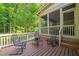 Outdoor deck features wood flooring and metal patio furniture at 19002 Stone Brk, Chapel Hill, NC 27517