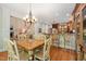 Open-concept dining area offers views of the living room, kitchen, and backyard at 19002 Stone Brk, Chapel Hill, NC 27517