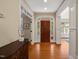 Welcoming foyer with hardwood floors and views of an adjacent room through an arched doorway at 19002 Stone Brk, Chapel Hill, NC 27517