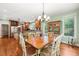 Open-concept kitchen with a central island, stainless steel appliances, and a dining area at 19002 Stone Brk, Chapel Hill, NC 27517