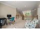 Bright loft area with a comfortable chair, desk and view of the windows and downstairs area at 19002 Stone Brk, Chapel Hill, NC 27517