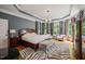 Spacious main bedroom features a tray ceiling, hardwood floors, neutral walls, and bay windows at 19002 Stone Brk, Chapel Hill, NC 27517