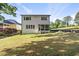 Expansive backyard features lush green grass, new landscaping, and a screened-in porch at 1904 French Dr, Raleigh, NC 27612
