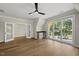 Bedroom featuring hardwood floors, ceiling fan and sliding glass doors to balcony at 1904 French Dr, Raleigh, NC 27612
