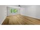 Bedroom with natural light, hardwood floors, decorative wall trim and a modern ceiling fan at 1904 French Dr, Raleigh, NC 27612