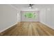Bedroom with natural light, hardwood floors, decorative wall trim and a modern ceiling fan at 1904 French Dr, Raleigh, NC 27612
