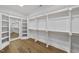 Spacious walk-in closet with custom shelving and ample storage space at 1904 French Dr, Raleigh, NC 27612